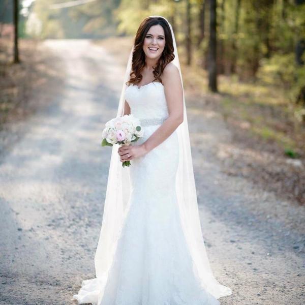 This lovely bridal bouquet is soft and elegant with white and pink roses. 